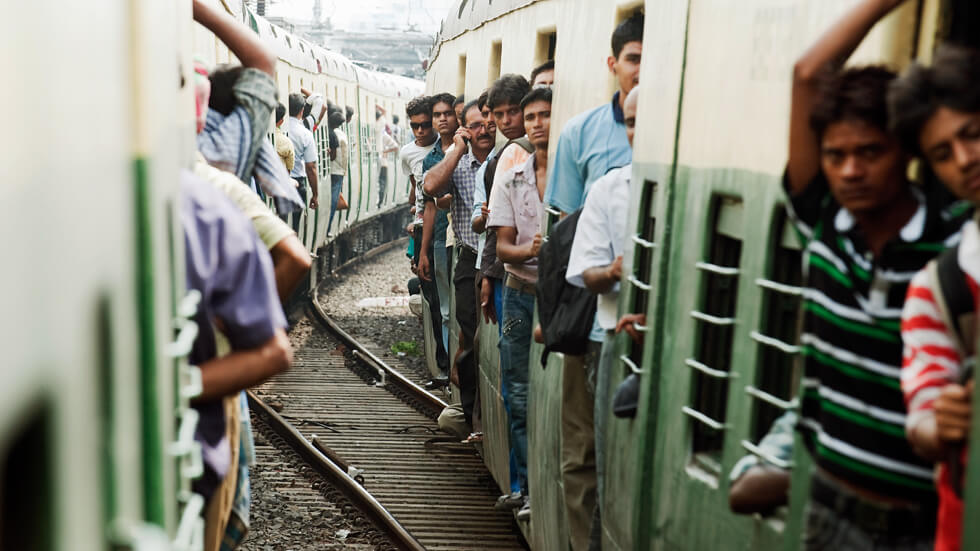 A view of passengers aboard trains connecting the suburbs of Kolkata, India. The Asia-Pacific region is urbanizing rapidly with 1.77 billion people, 43% of the region's population, living in urban areas. UN Photo/Kibae Park